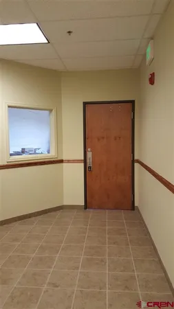 a view of a hallway with a window
