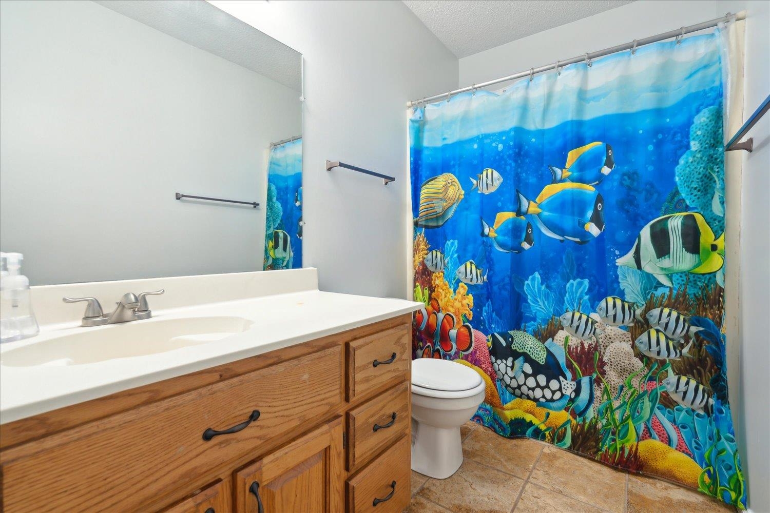88 East Rae Road Munford, TN 38058 - Photo 24 of 30 Bathroom with vanity, a textured ceiling, and toilet
