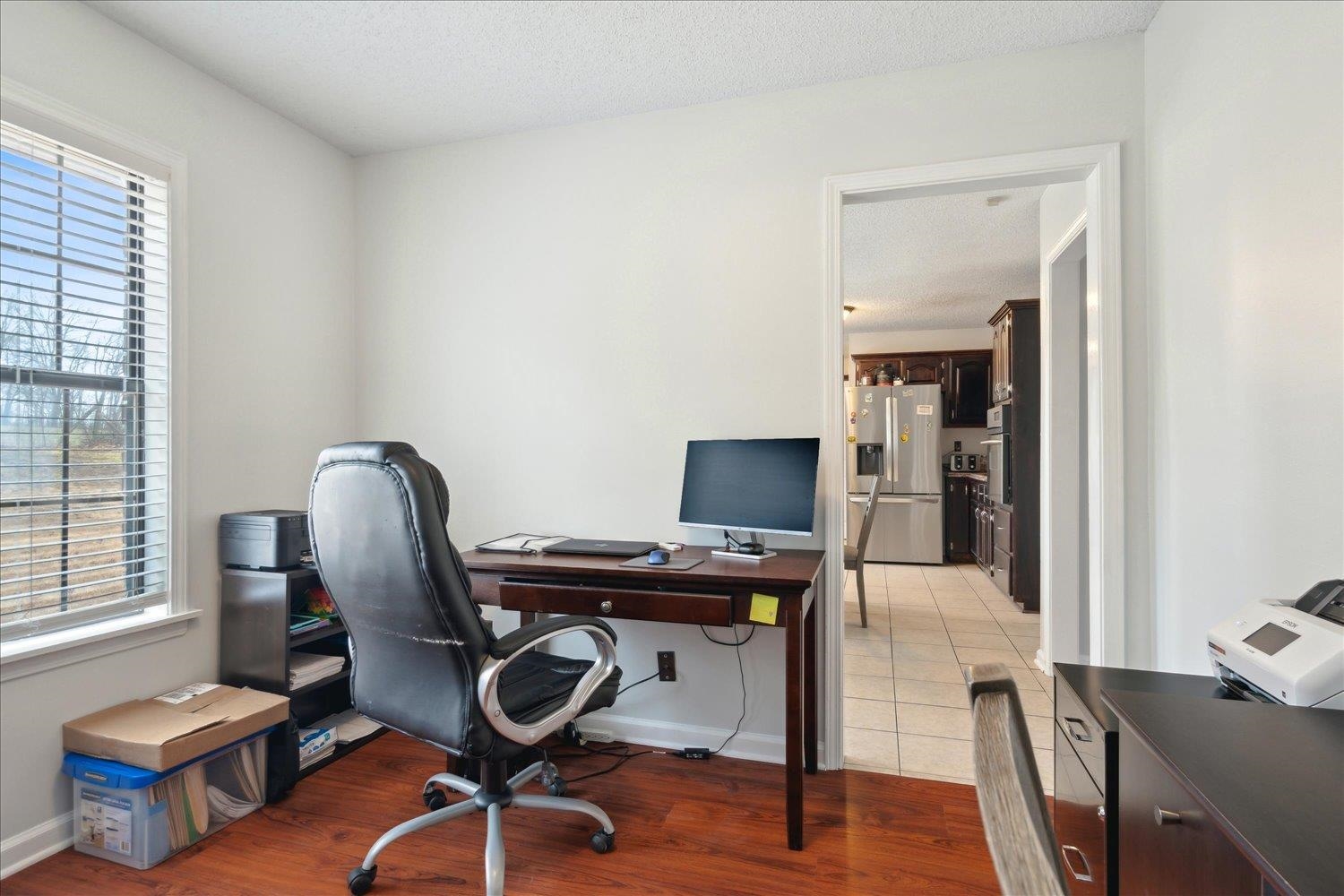 88 East Rae Road Munford, TN 38058 - Photo 10 of 30 Office space featuring a healthy amount of sunlight, hardwood / wood-style floors, and a textured ceiling