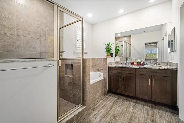 a bathroom with a double vanity sink and mirror