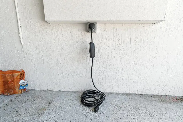 a view of a house with a yard and a garden