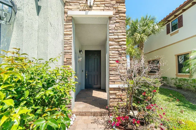 a potted plant sitting in front of a house
