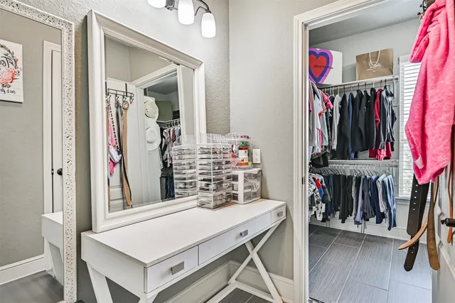 a view of a patio with table and chairs and potted plants