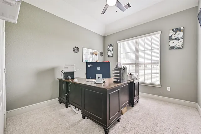a dining room with furniture a chandelier and wooden floor