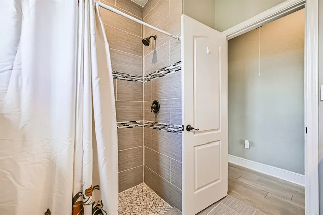 a kitchen with stainless steel appliances granite countertop a refrigerator a stove and a sink