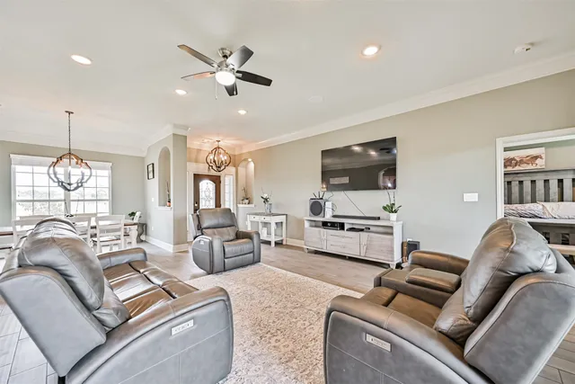 a view of a dining room with furniture and wooden floor