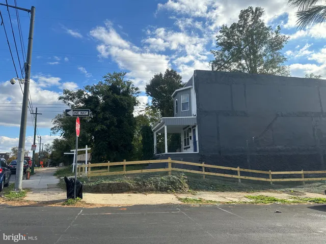 a view of swimming pool with a yard and plants