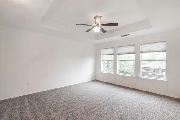 an empty room with staircase and white walls