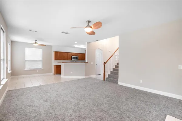 a kitchen with stainless steel appliances granite countertop a sink stove oven and microwave