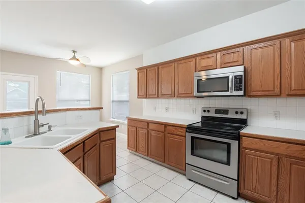 a kitchen with a sink and cabinets
