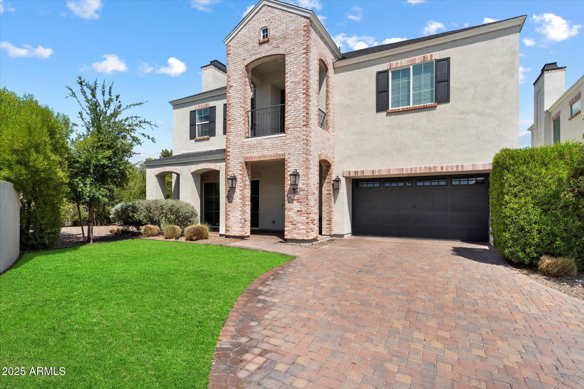 640 West Echo Lane Phoenix, AZ 85021 - Photo 1 of 55 a front view of a house with a yard and garage