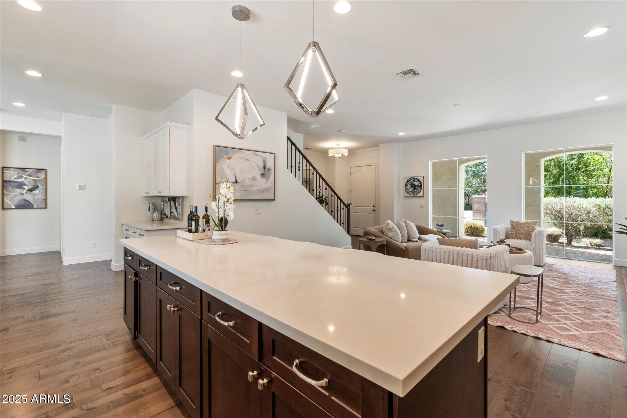 640 West Echo Lane Phoenix, AZ 85021 - Photo 13 of 55 a living room with stainless steel appliances kitchen island a table chairs and a view of living room