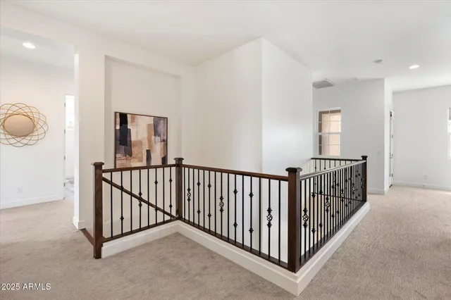 a view of a hallway with windows