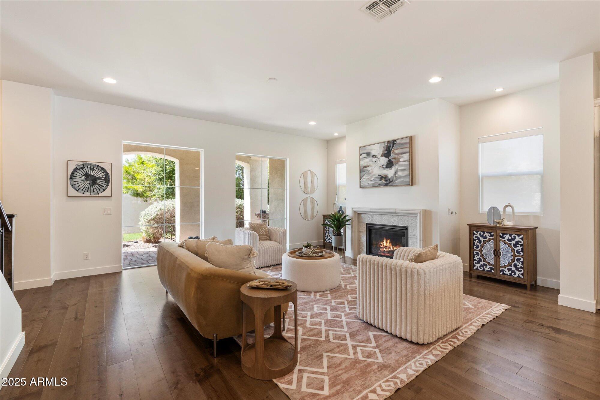 640 West Echo Lane Phoenix, AZ 85021 - Photo 2 of 55 a living room with fireplace furniture and a wooden floor