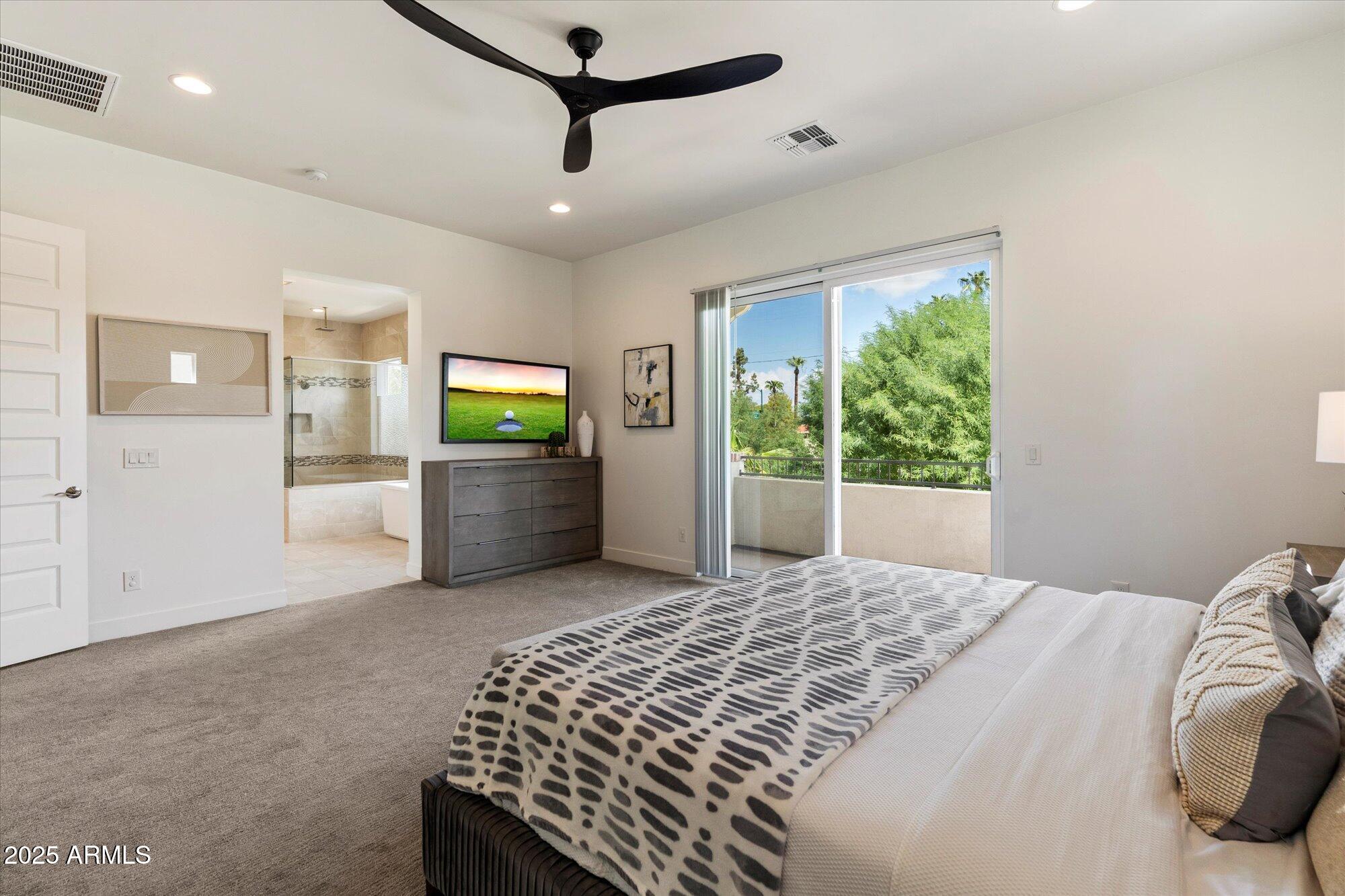 640 West Echo Lane Phoenix, AZ 85021 - Photo 21 of 55 a bedroom with a bed and a large window