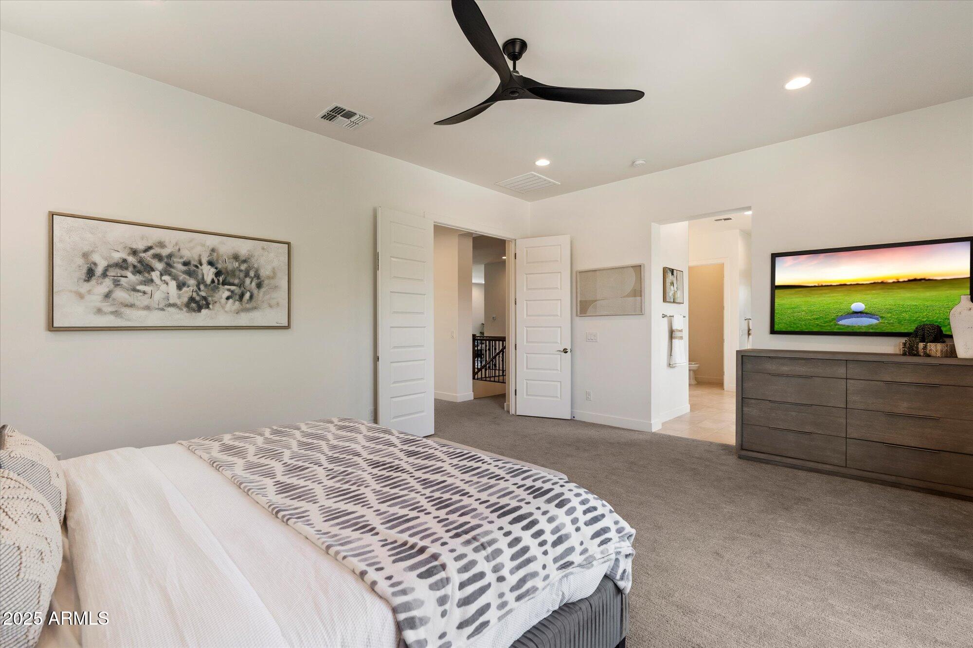 640 West Echo Lane Phoenix, AZ 85021 - Photo 22 of 55 a bedroom with a bed and a flat screen tv