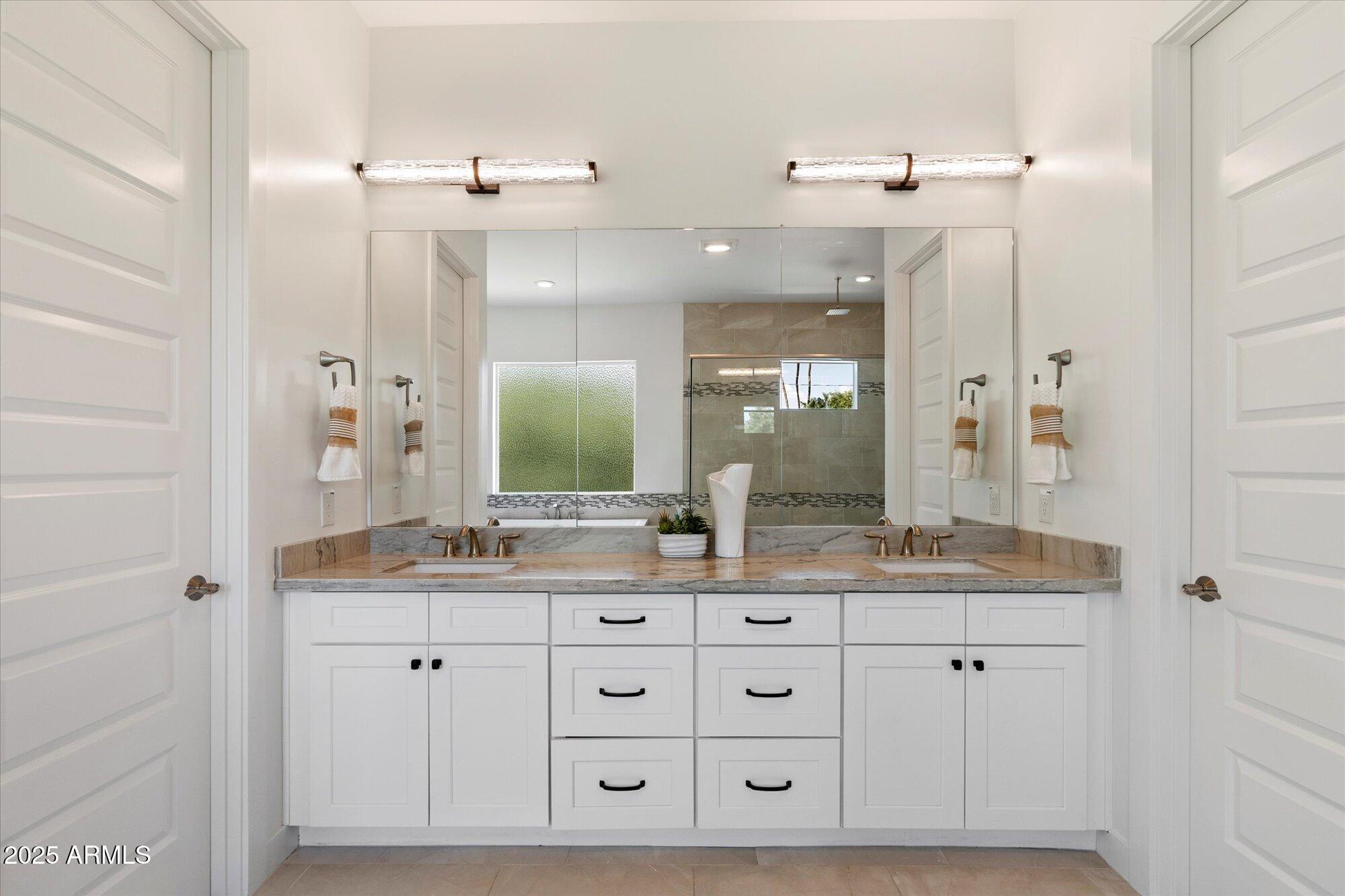 640 West Echo Lane Phoenix, AZ 85021 - Photo 26 of 55 a bathroom with a granite countertop sink mirror and double
