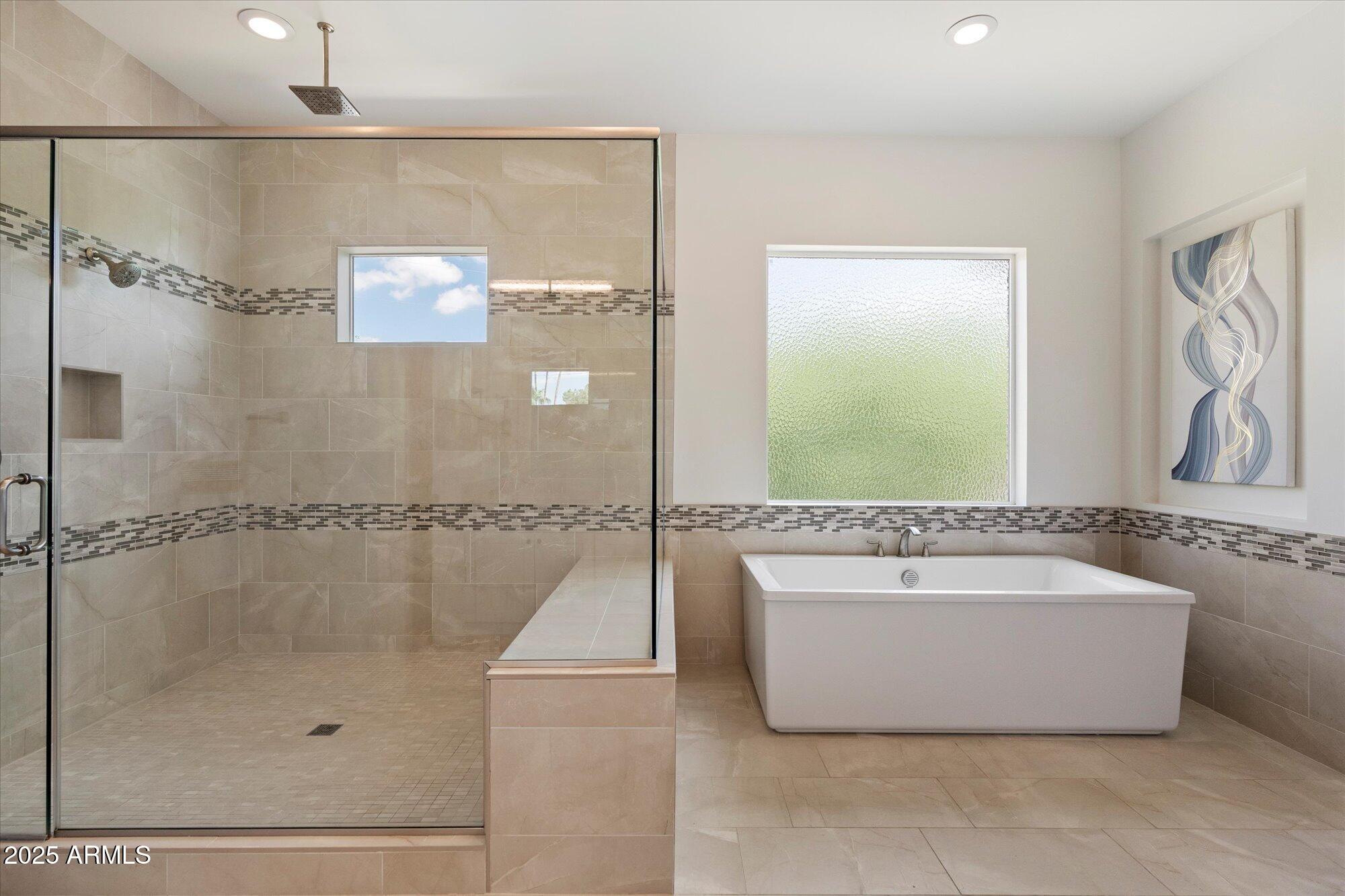 640 West Echo Lane Phoenix, AZ 85021 - Photo 27 of 55 a bathroom with a tub a sink and a shower