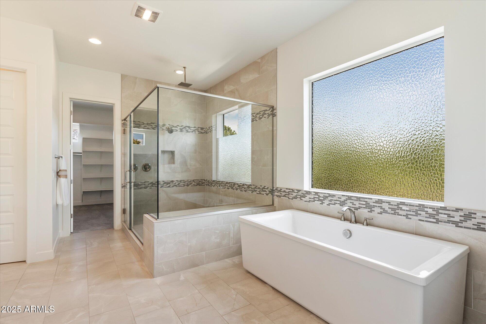 640 West Echo Lane Phoenix, AZ 85021 - Photo 28 of 55 a spacious bathroom with a large tub shower and sink