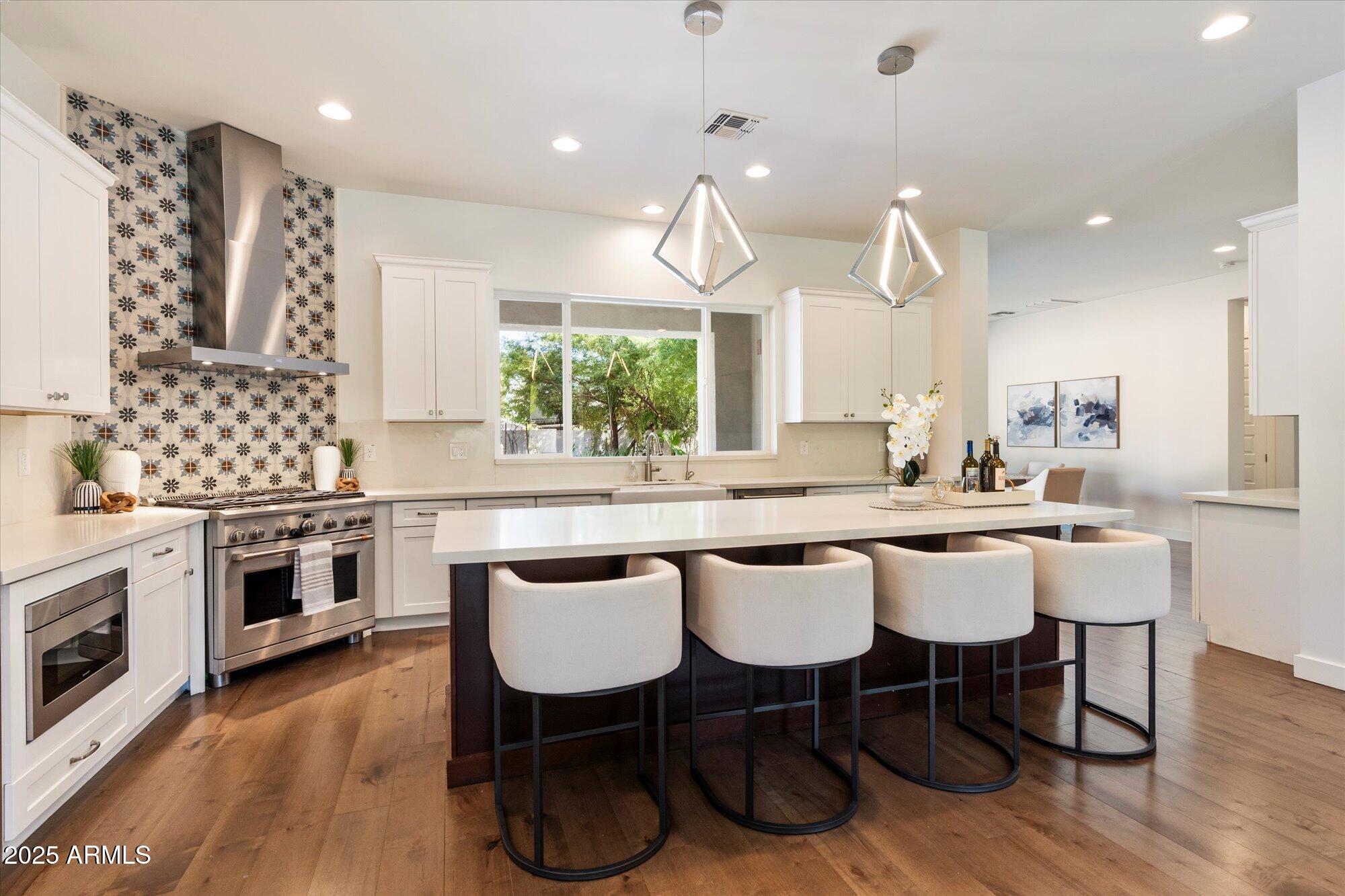 640 West Echo Lane Phoenix, AZ 85021 - Photo 3 of 55 a large kitchen with a table and chairs