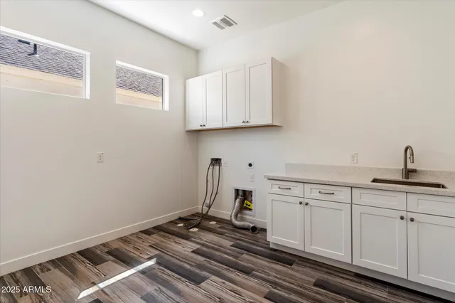 a view of a patio with table and chairs potted plants with wooden floor