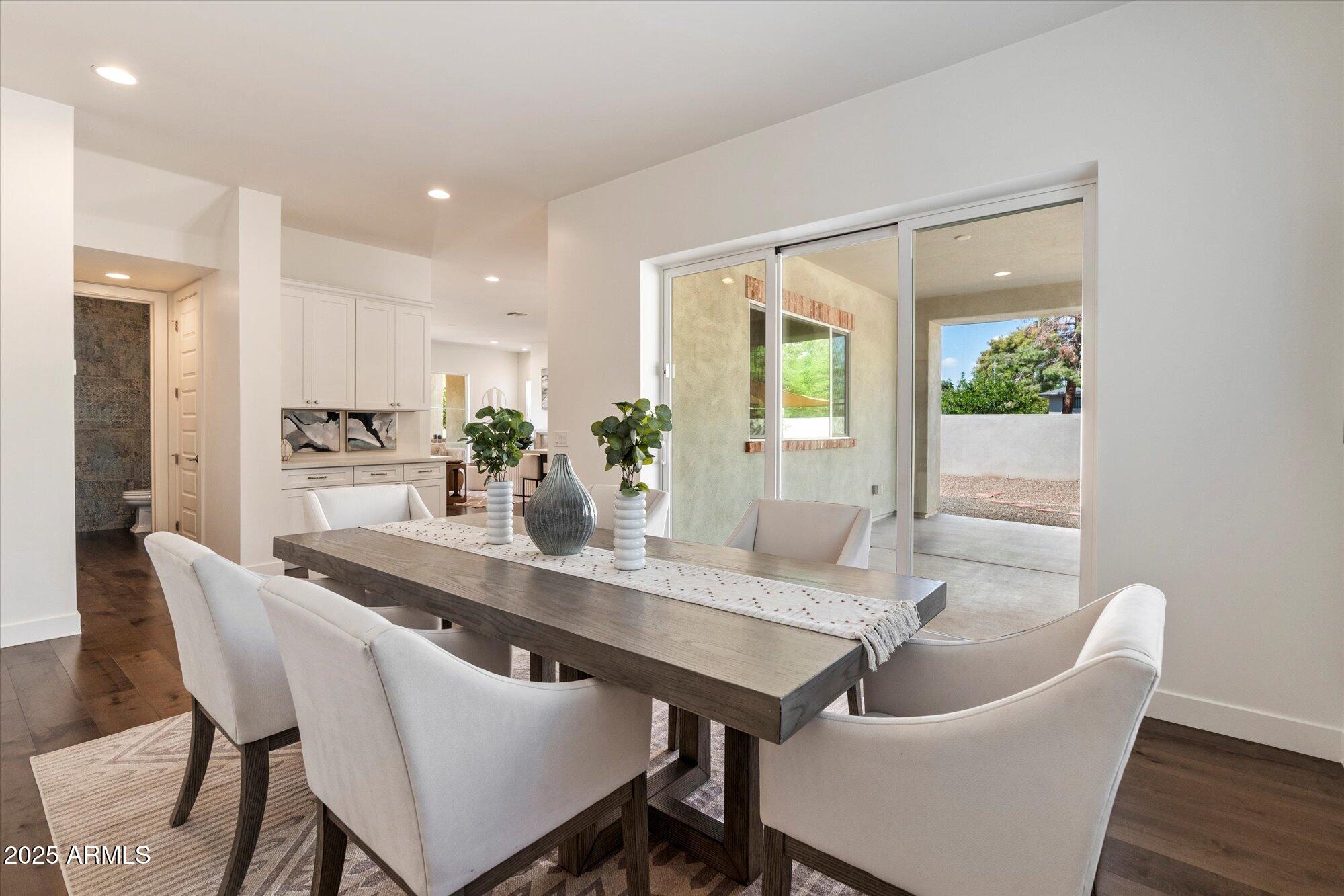 640 West Echo Lane Phoenix, AZ 85021 - Photo 4 of 55 a dining room with furniture and wooden floor