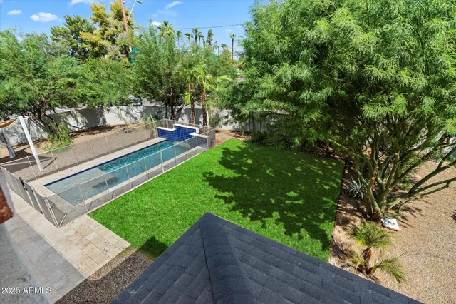 a backyard of a house with basket ball court