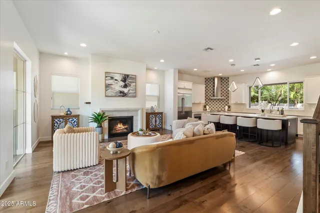 a living room with fireplace furniture and a fireplace