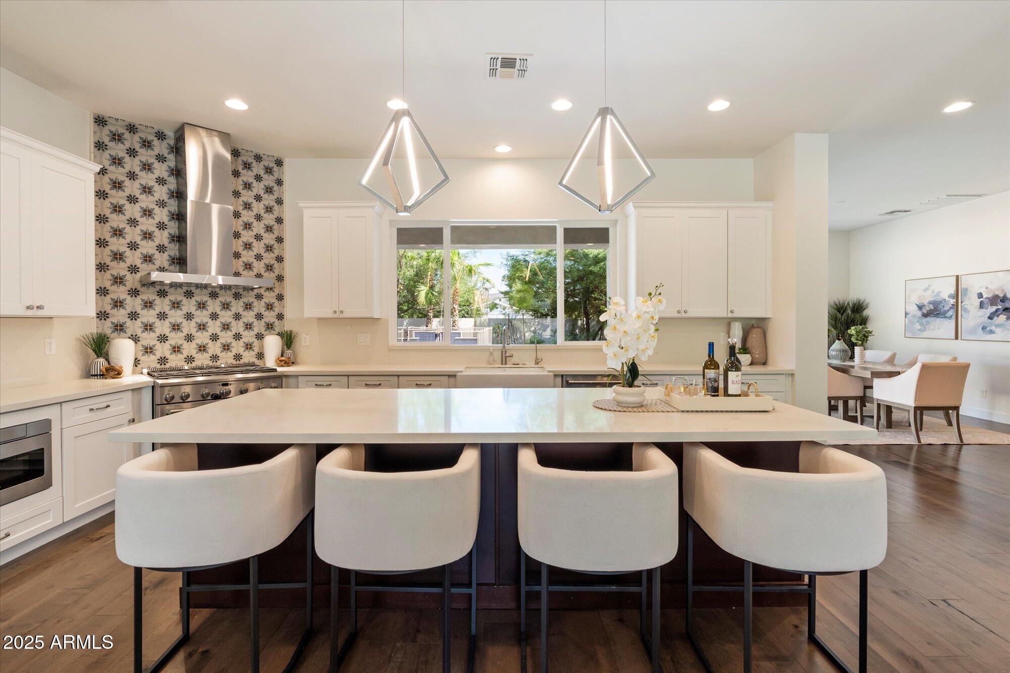 640 West Echo Lane Phoenix, AZ 85021 - Photo 10 of 55 a large kitchen with a table and chairs