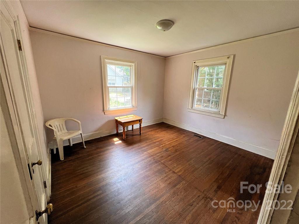 1322 Shamrock Drive Charlotte, NC 28205 - Photo 17 of 21 a living room with furniture and a window