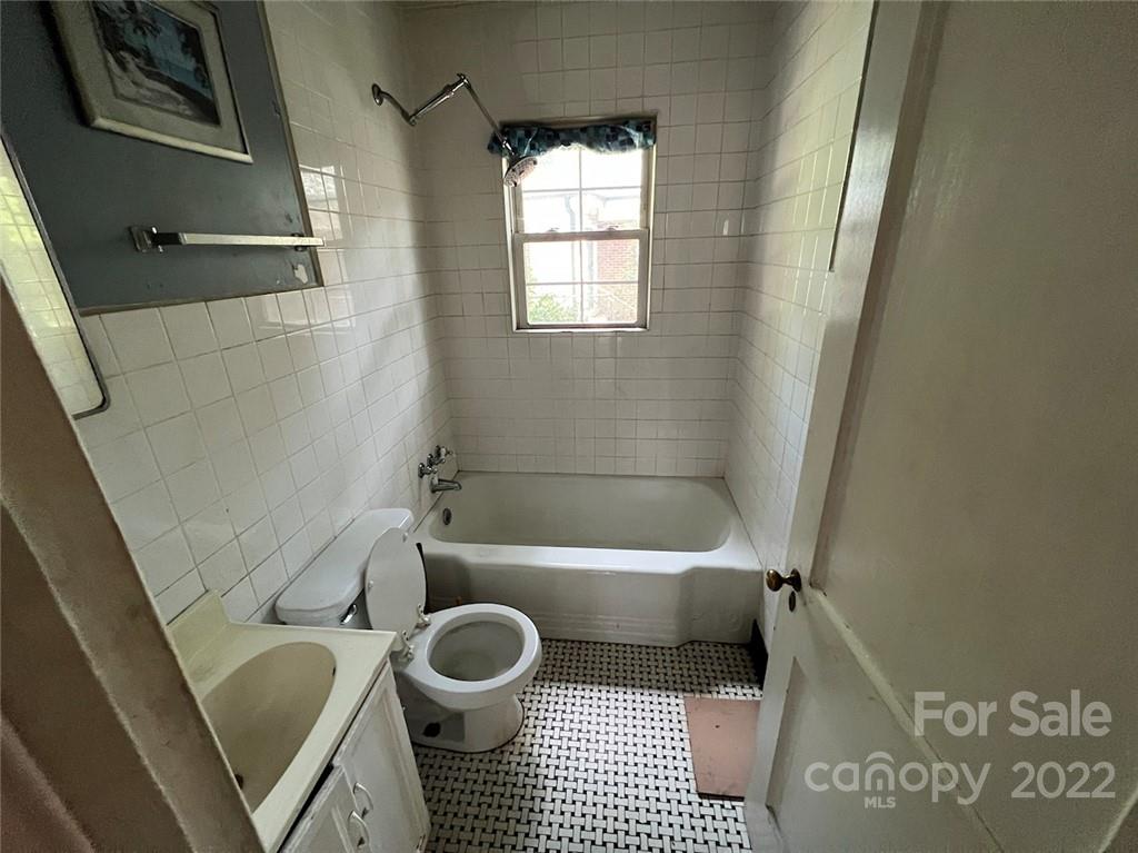 1322 Shamrock Drive Charlotte, NC 28205 - Photo 21 of 21 a bathroom with a bathtub and a shower