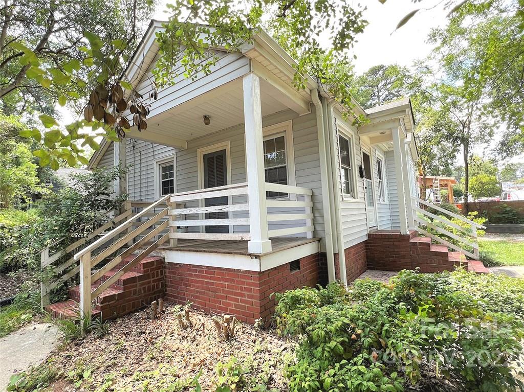 1322 Shamrock Drive Charlotte, NC 28205 - Photo 5 of 21 front view of a house with a yard