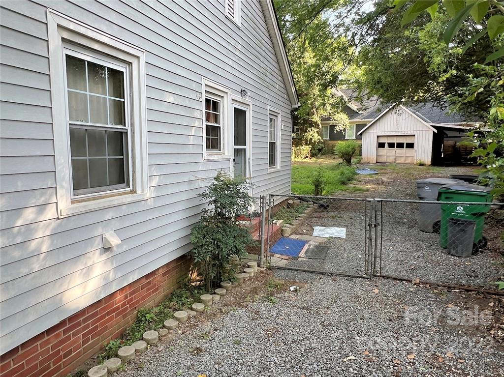 1322 Shamrock Drive Charlotte, NC 28205 - Photo 8 of 21 a front view of a house with a yard