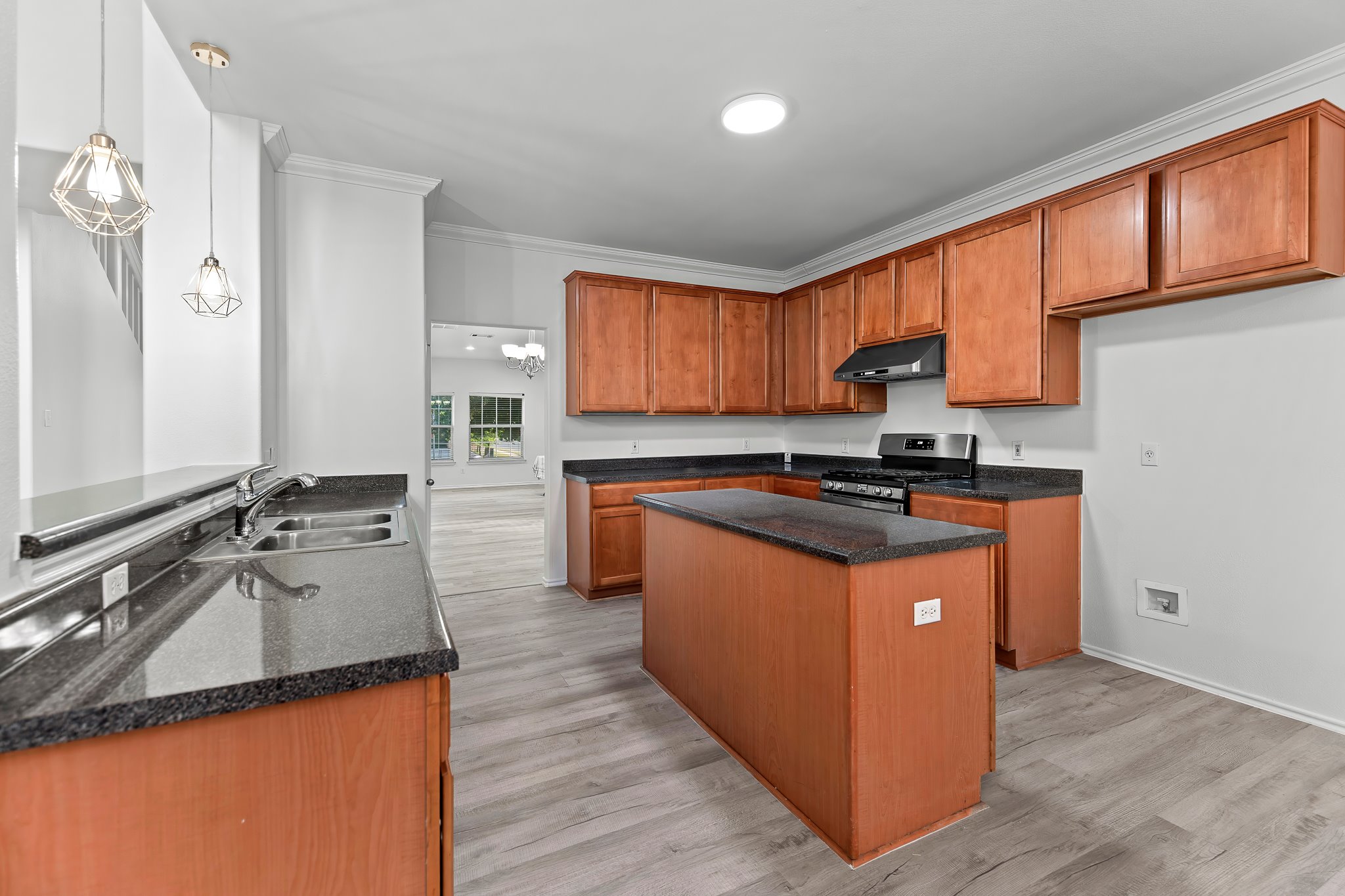 6700 Tulloch Way Austin, TX 78754 - Photo 14 of 39 a kitchen with granite countertop a sink counter top space and cabinets