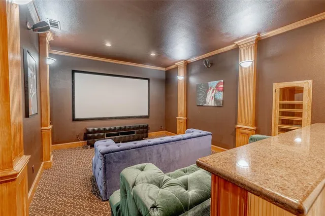 a room with furniture pool table and projector