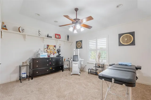 a bed room with furniture and window