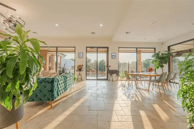a lobby with furniture and floor to ceiling window