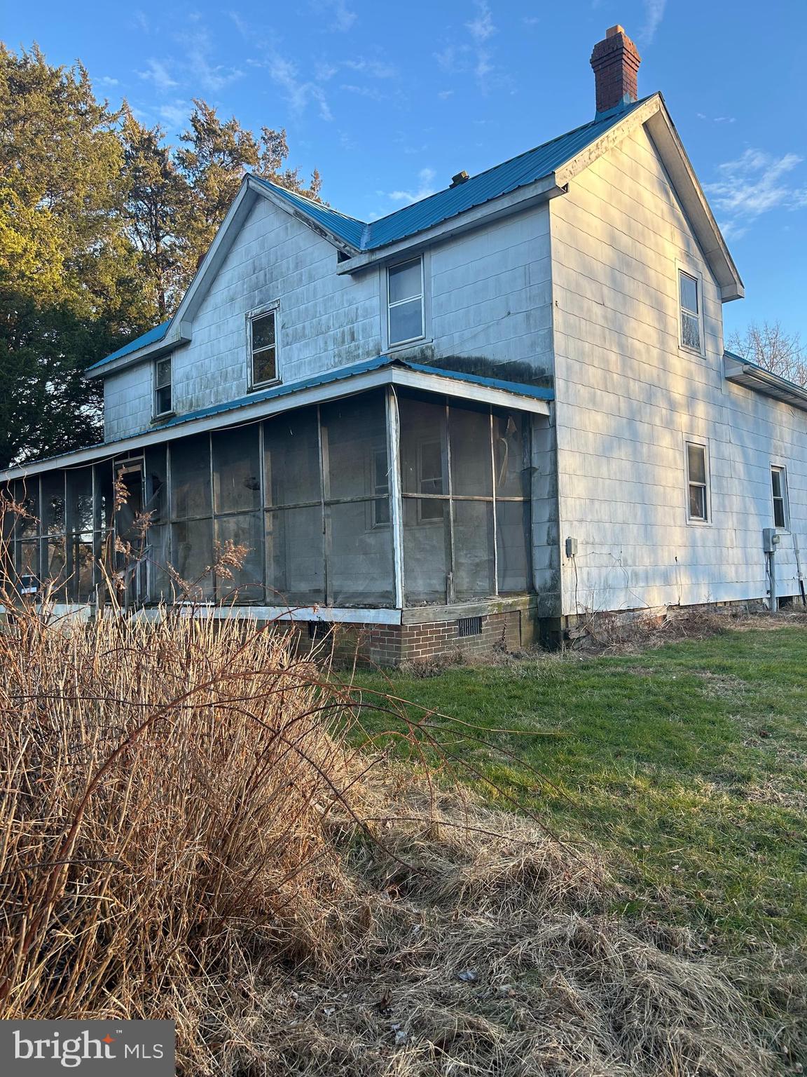 3950 Faith Lane Huntingtown, MD 20639 - Photo 3 of 8 a front view of a house with a garden