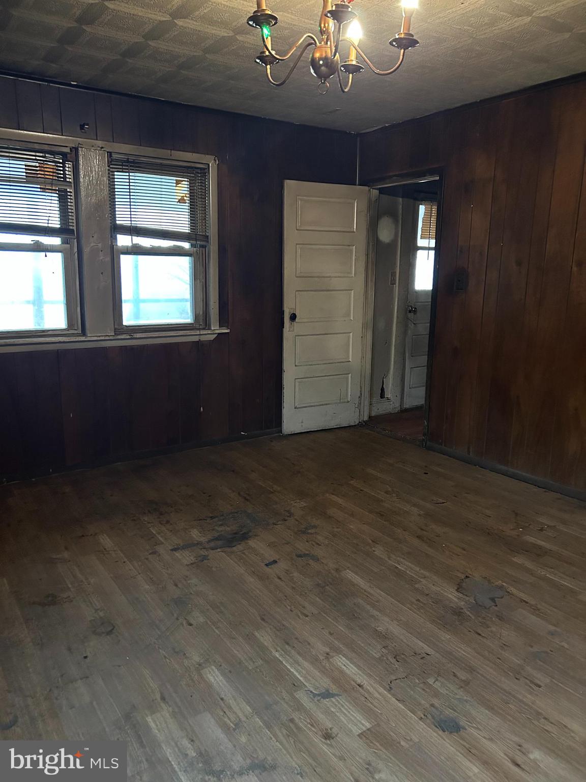 3950 Faith Lane Huntingtown, MD 20639 - Photo 4 of 8 an empty room with wooden floor and windows