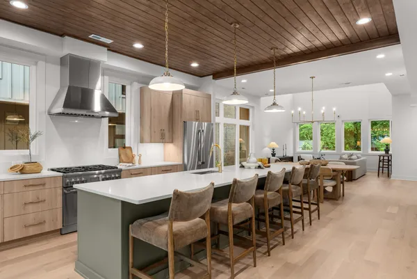 a kitchen with lots of table and chairs