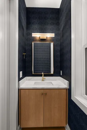 a bathroom with a sink and mirror