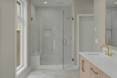 a bathroom with a shower sink and toilet