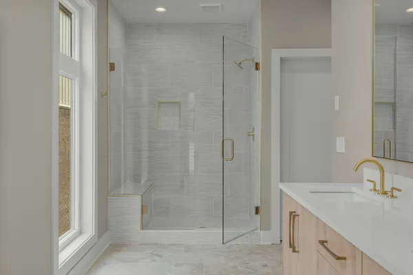 a bathroom with a shower sink and toilet