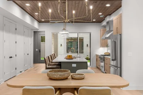 a kitchen with a table and chairs