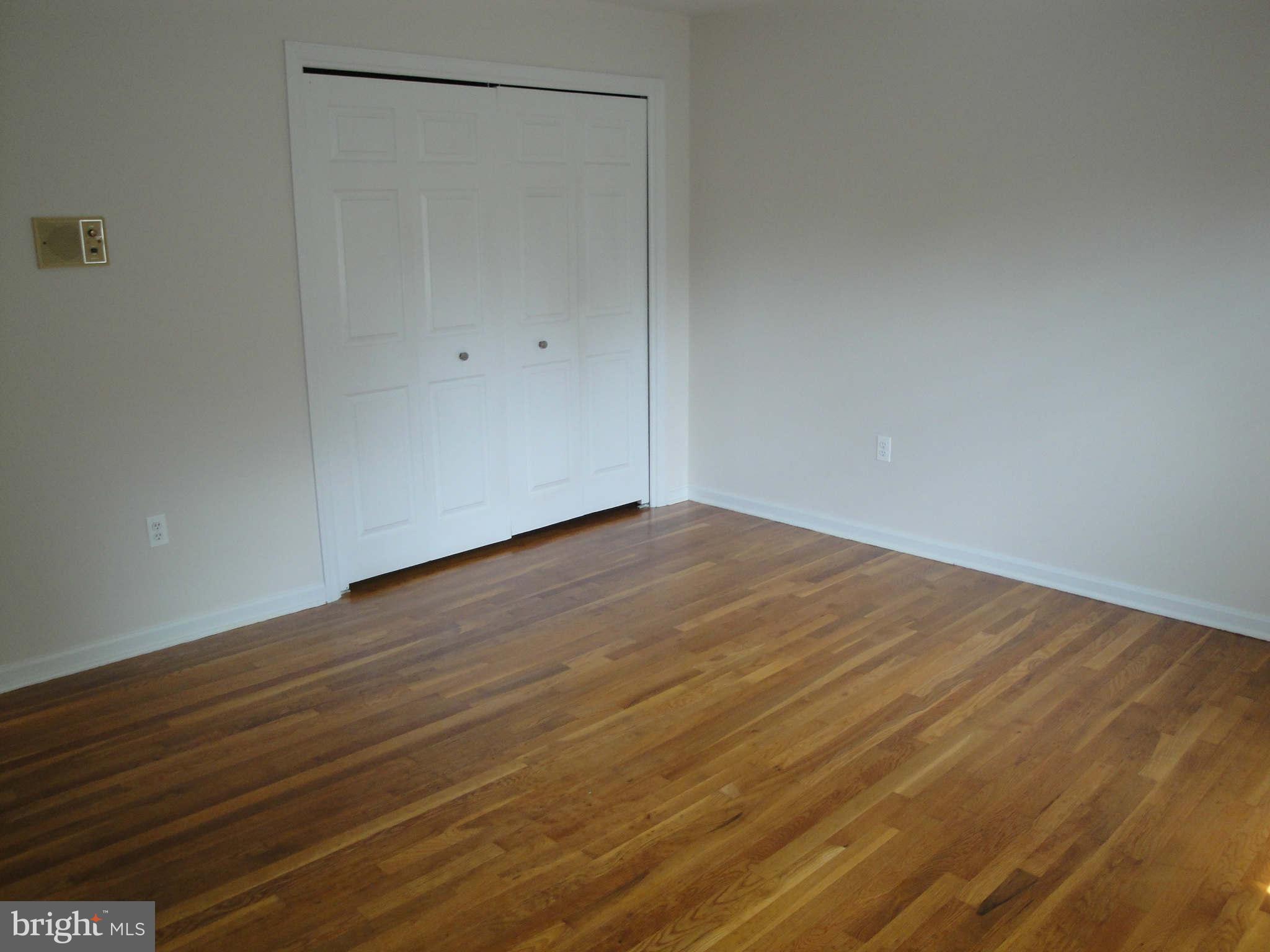 13212 Tamarack Road Silver Spring, MD 20904 - Photo 12 of 28 a view of an empty room with wooden floor