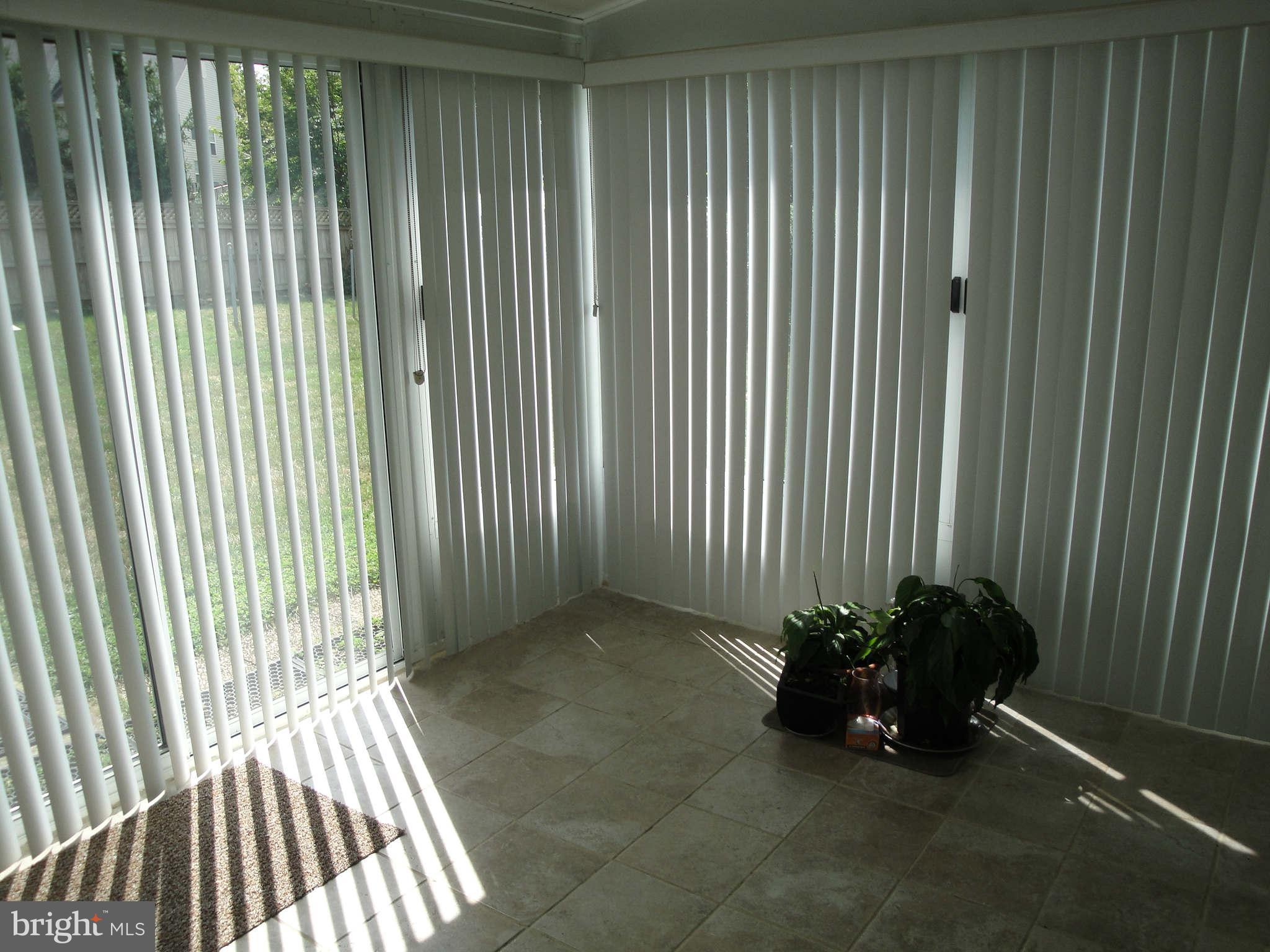 13212 Tamarack Road Silver Spring, MD 20904 - Photo 25 of 28 a view of a porch with a floor to ceiling window