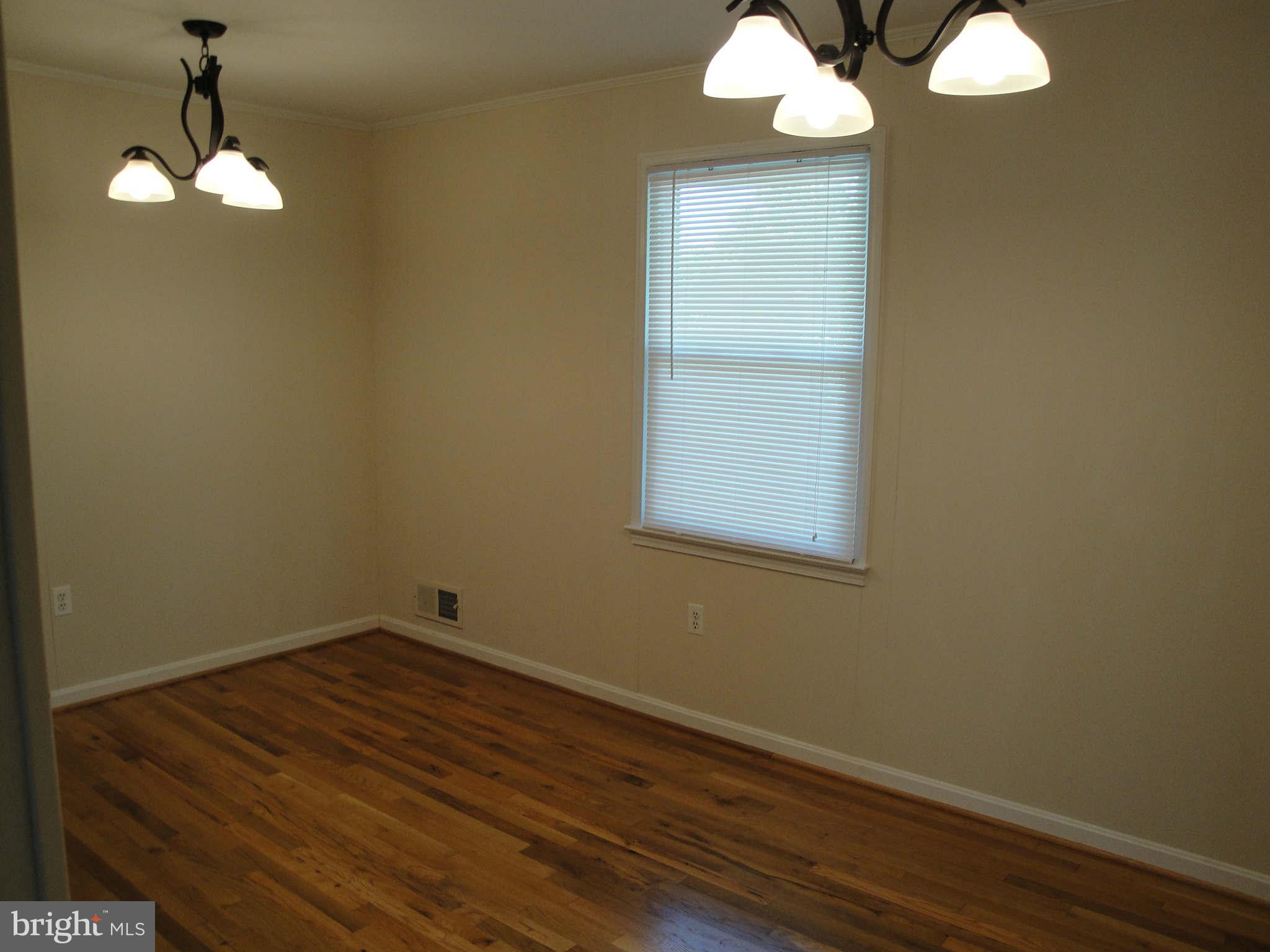 13212 Tamarack Road Silver Spring, MD 20904 - Photo 26 of 28 wooden floor in an empty room with a mirror