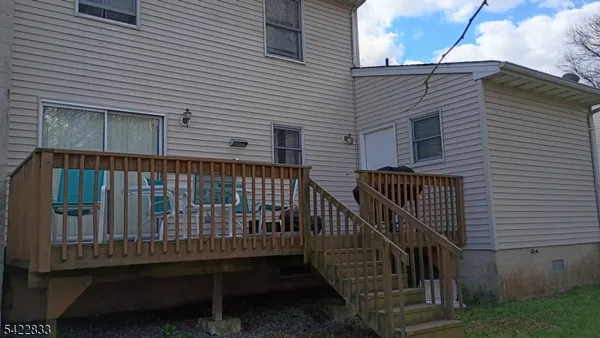 a view of balcony with wooden fence