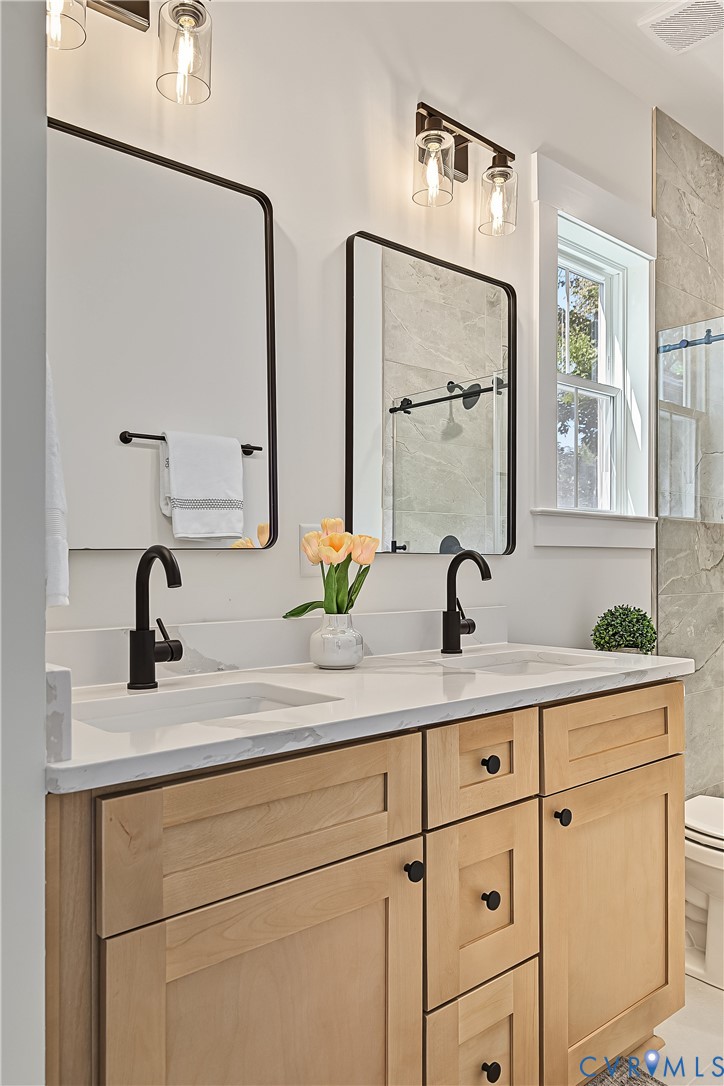 3601.5 Decatur Street Richmond, VA 23224 - Photo 20 of 32 Dual vanity with light wood-finish cabinetry, whit