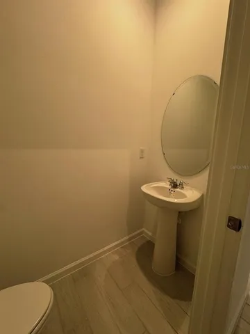 a bathroom with a sink and mirror